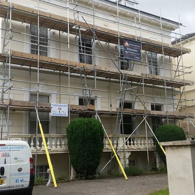 Scaffolding around a house, ready to be painted